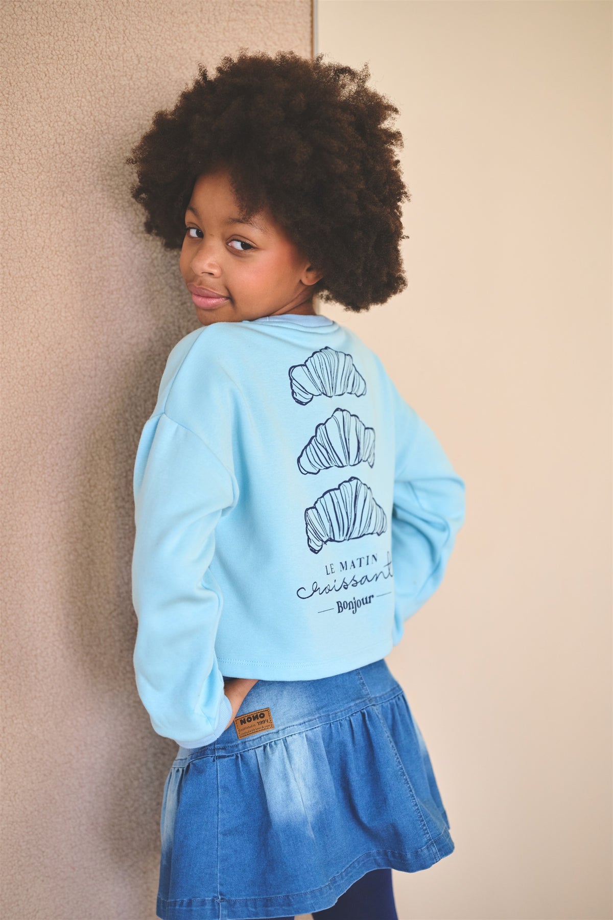 Jersey corto suave de pelo con estampado de croissants Kuya niña